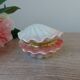Vintage shell-shaped catchall in iridescent cream and pink ceramic.