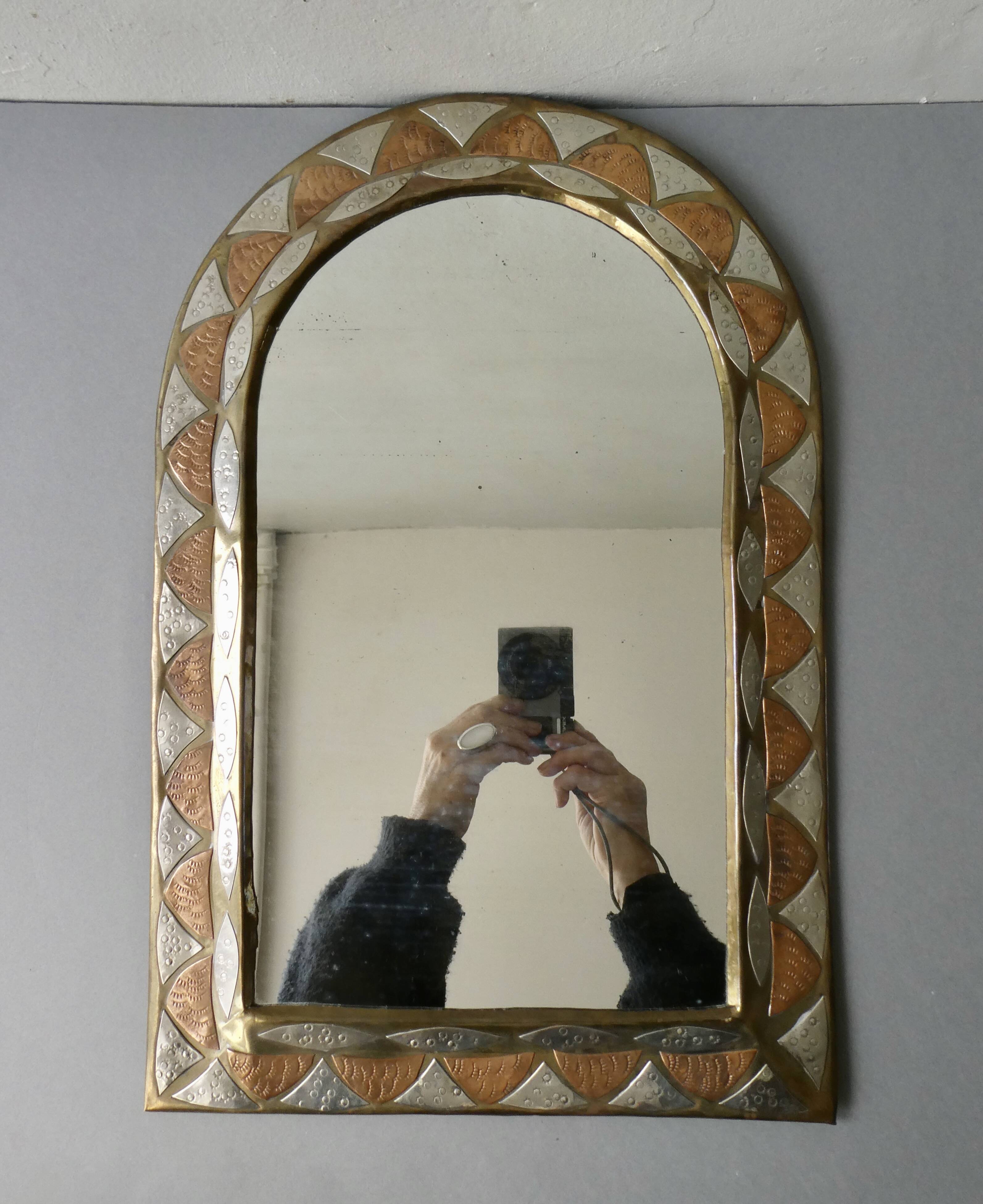 Moroccan mirror in chiseled brass, copper and silver, 70s-80s