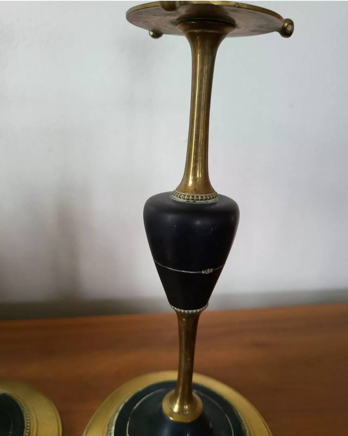 Pair of brass and black hard stone candlesticks