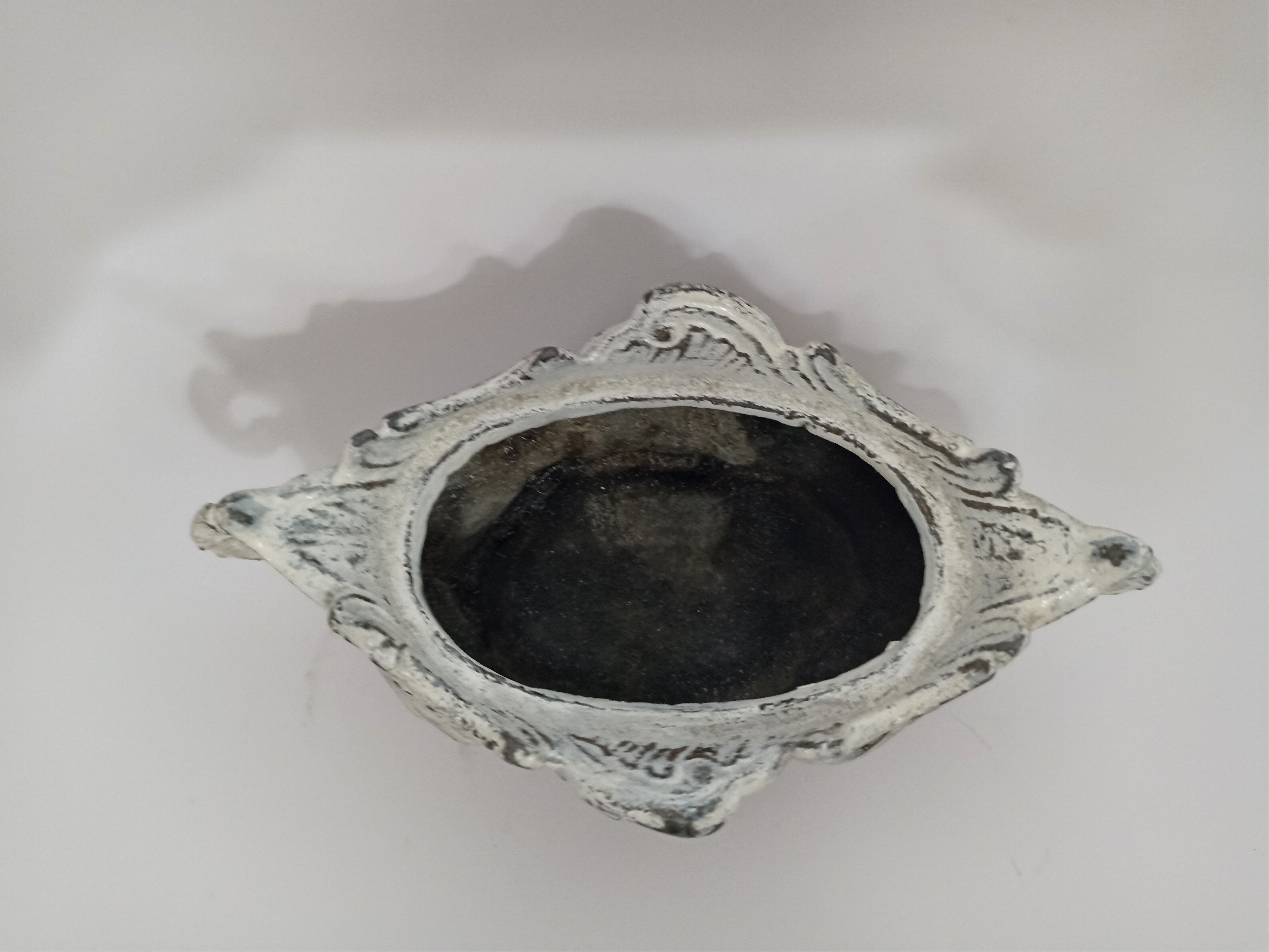 Old patinated cast iron planter