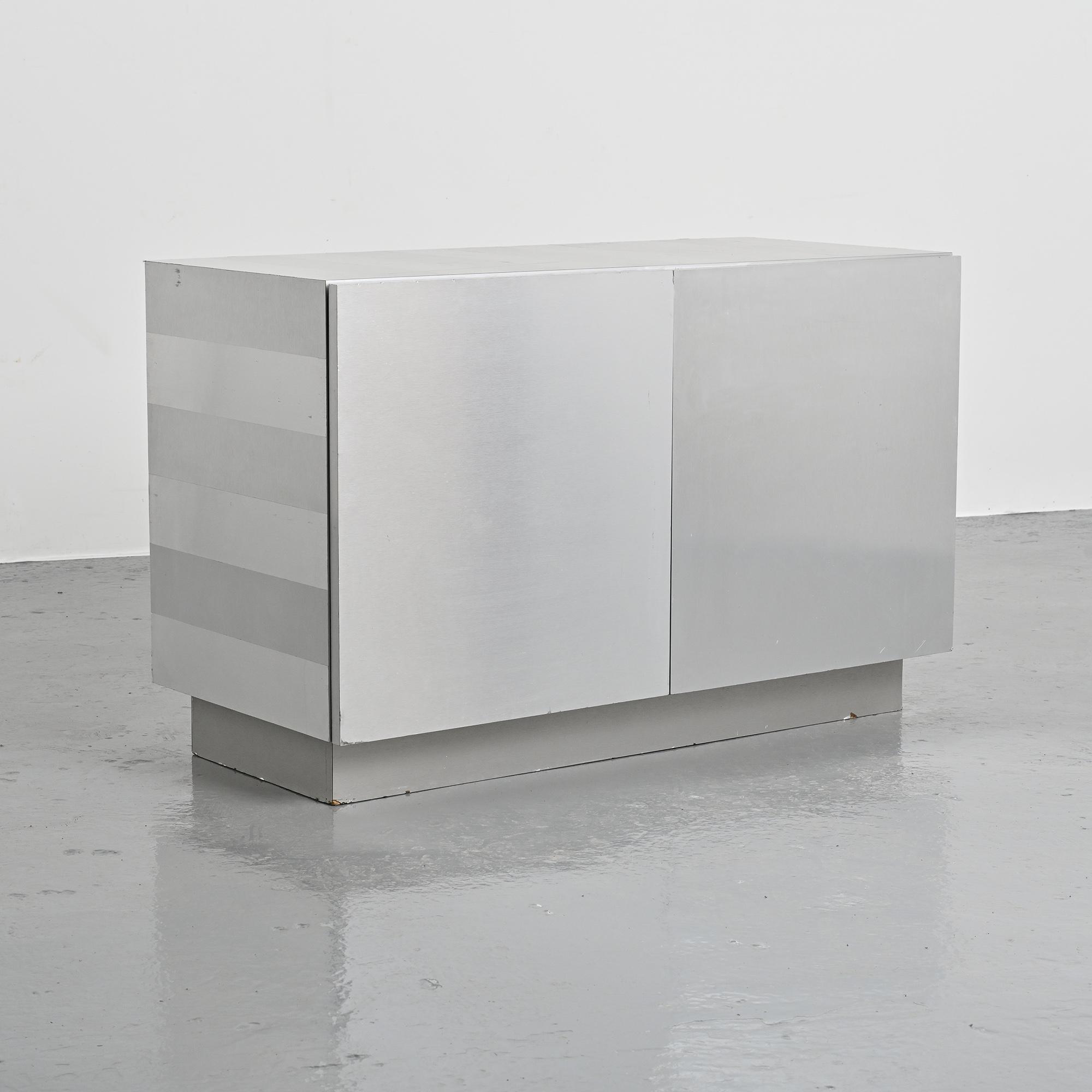 Pair of low buffets in brushed metal, French work, 1970s.