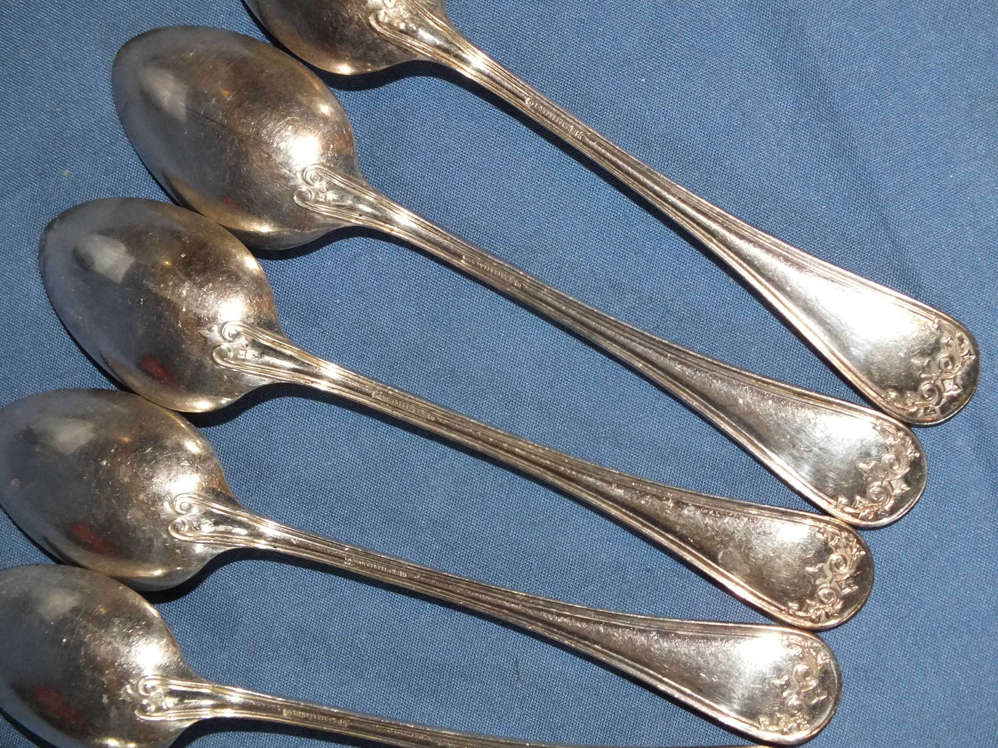 Old box of 12 small white metal spoons