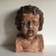 Bust old child in plaster stamped l.j.c.