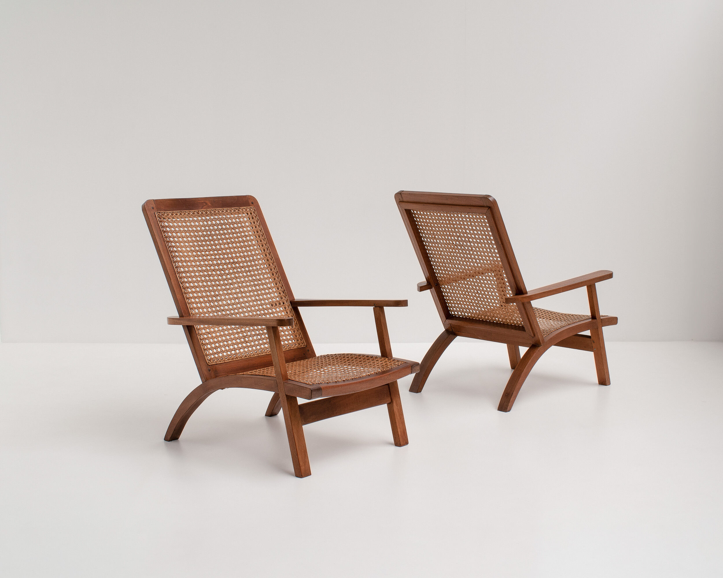 pair of french mahogany and cane armchairs, 1950s