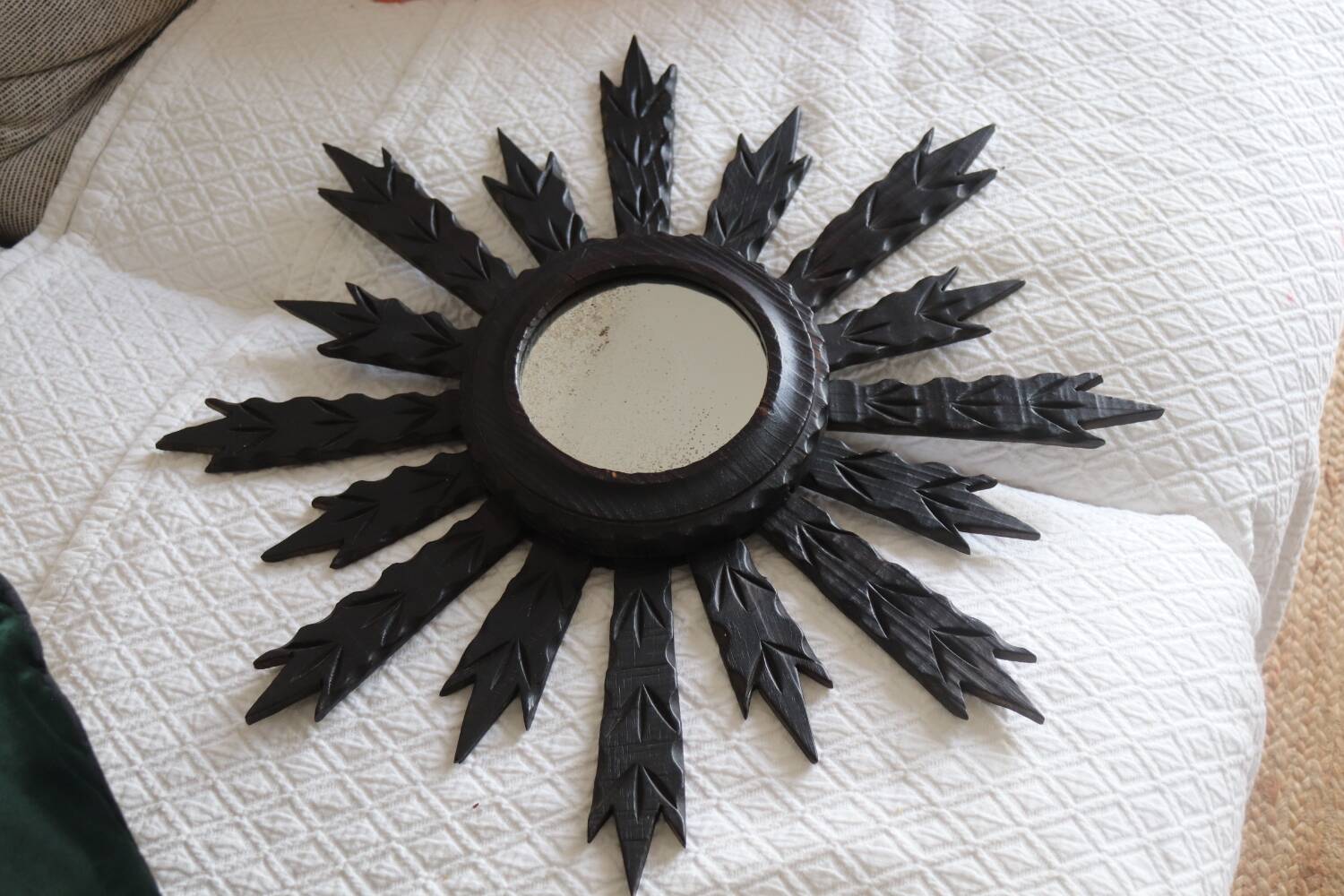 Antique black wooden sun mirror