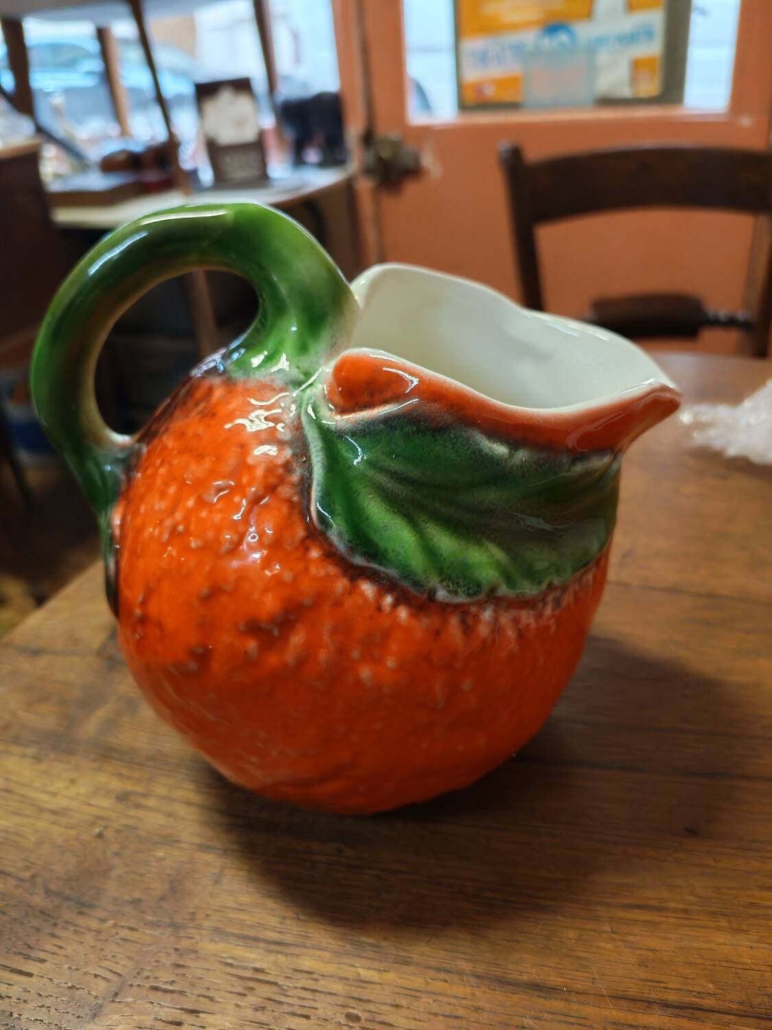Orange slipware pitcher
