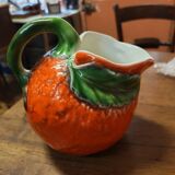 Orange slipware pitcher