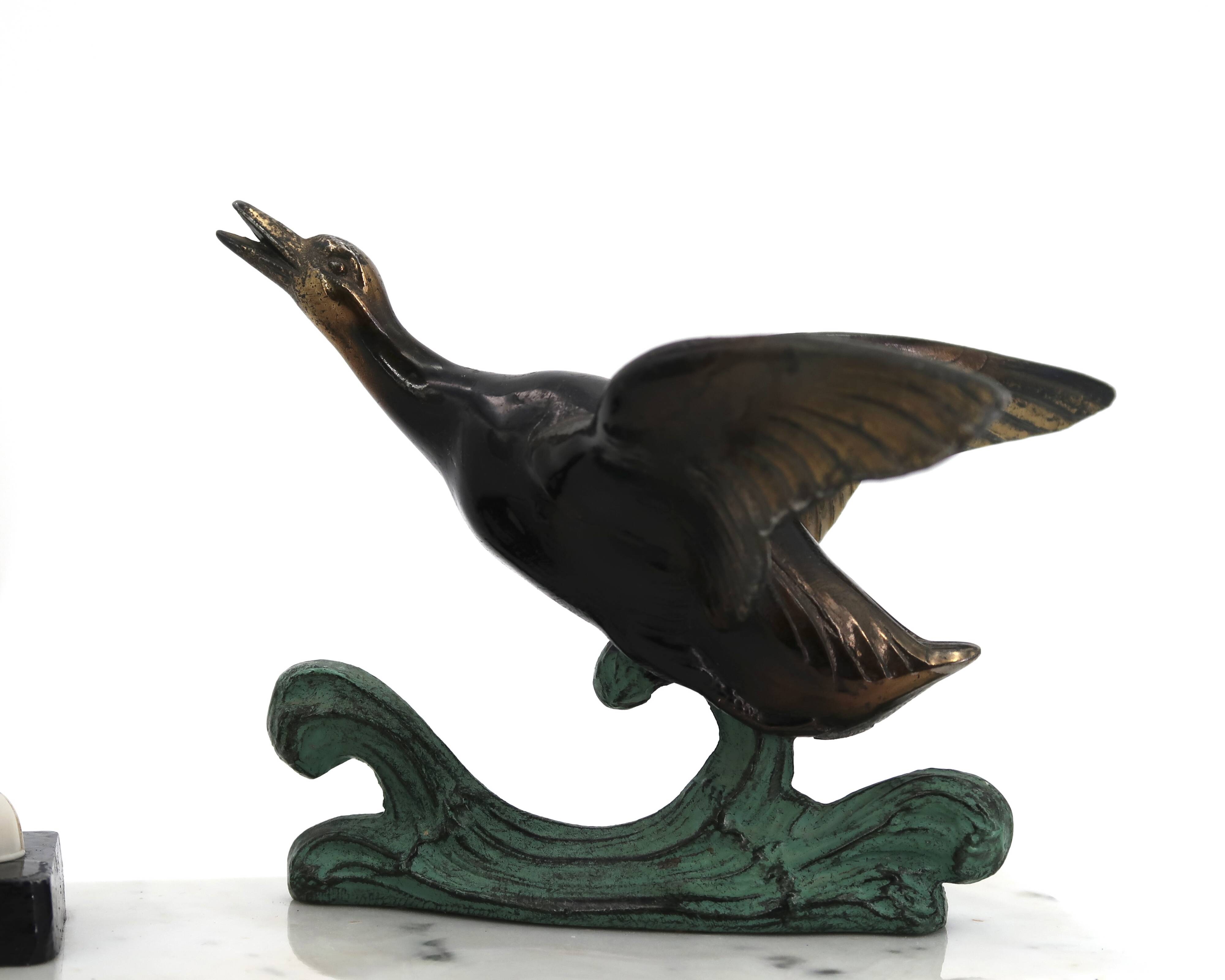 Art Deco lamp decorated with a flying duck, marble base, 1930s.