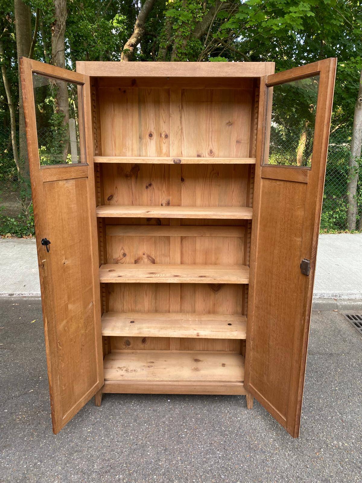 Parisian bonnetière cabinet, stripped display in solid oak from the 1930s.