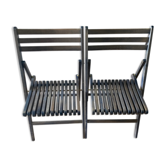 Duo of vintage folding chairs in solid wood