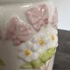 Antique ceramic vase with flowers and butterflies