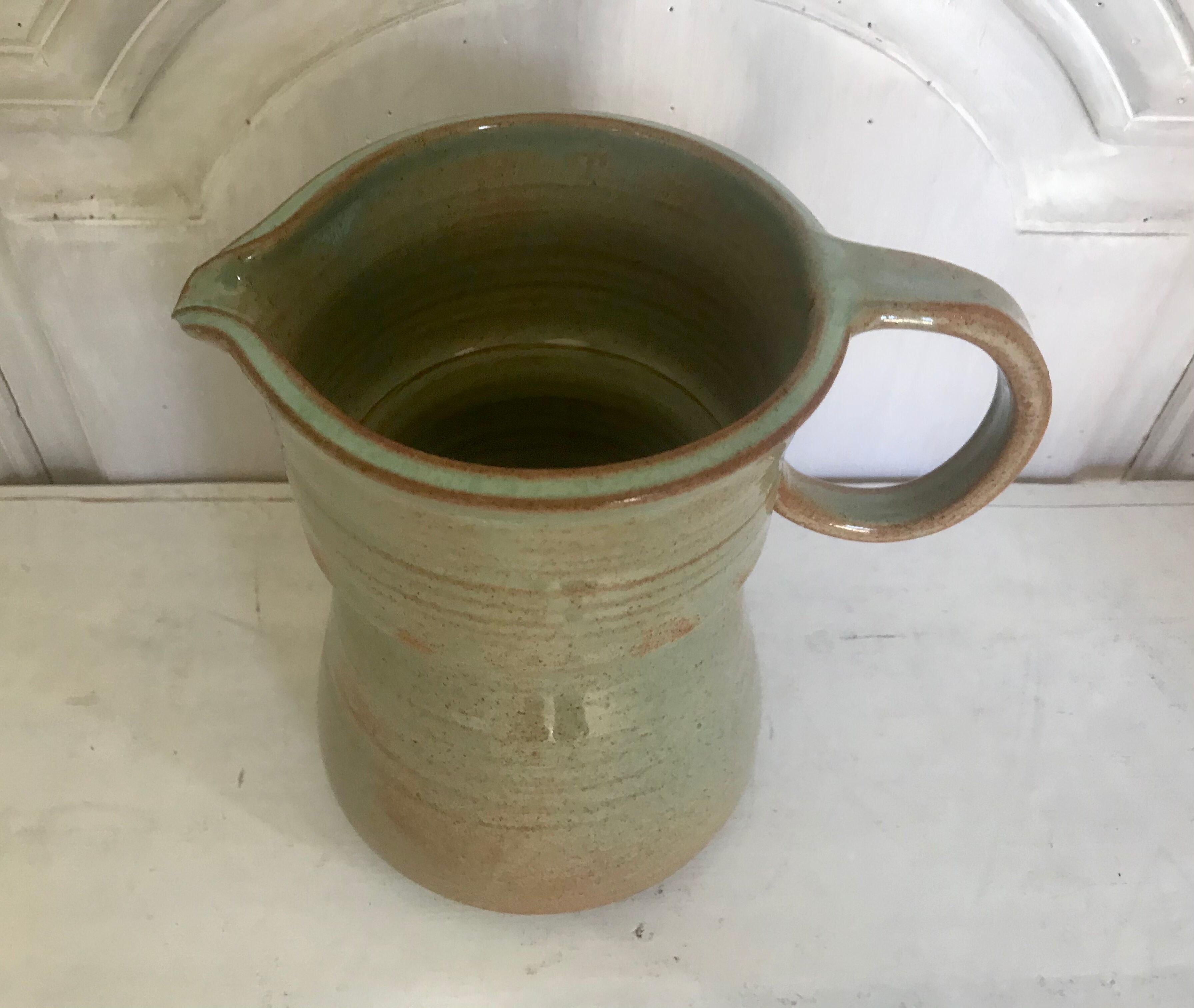 Pitcher and its vintage sandstone glasses