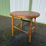 Rattan side table with round woven top
