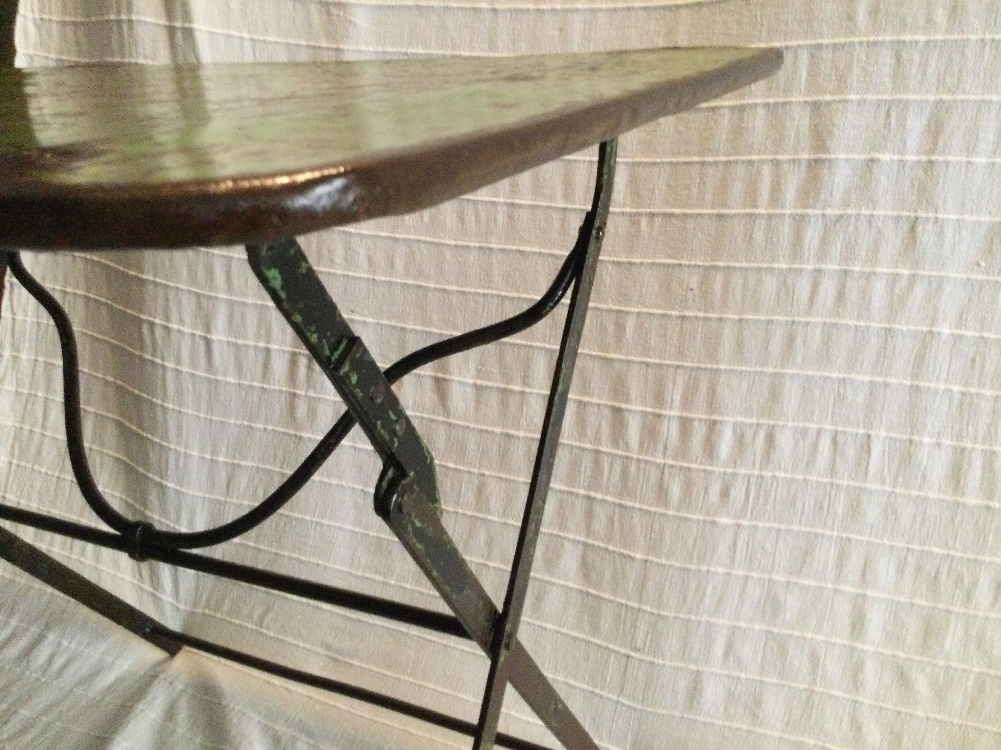 Folding riveted iron table