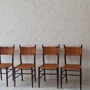 Four teak dining chairs with patinated cane after Gio Ponti, Italy 1960s