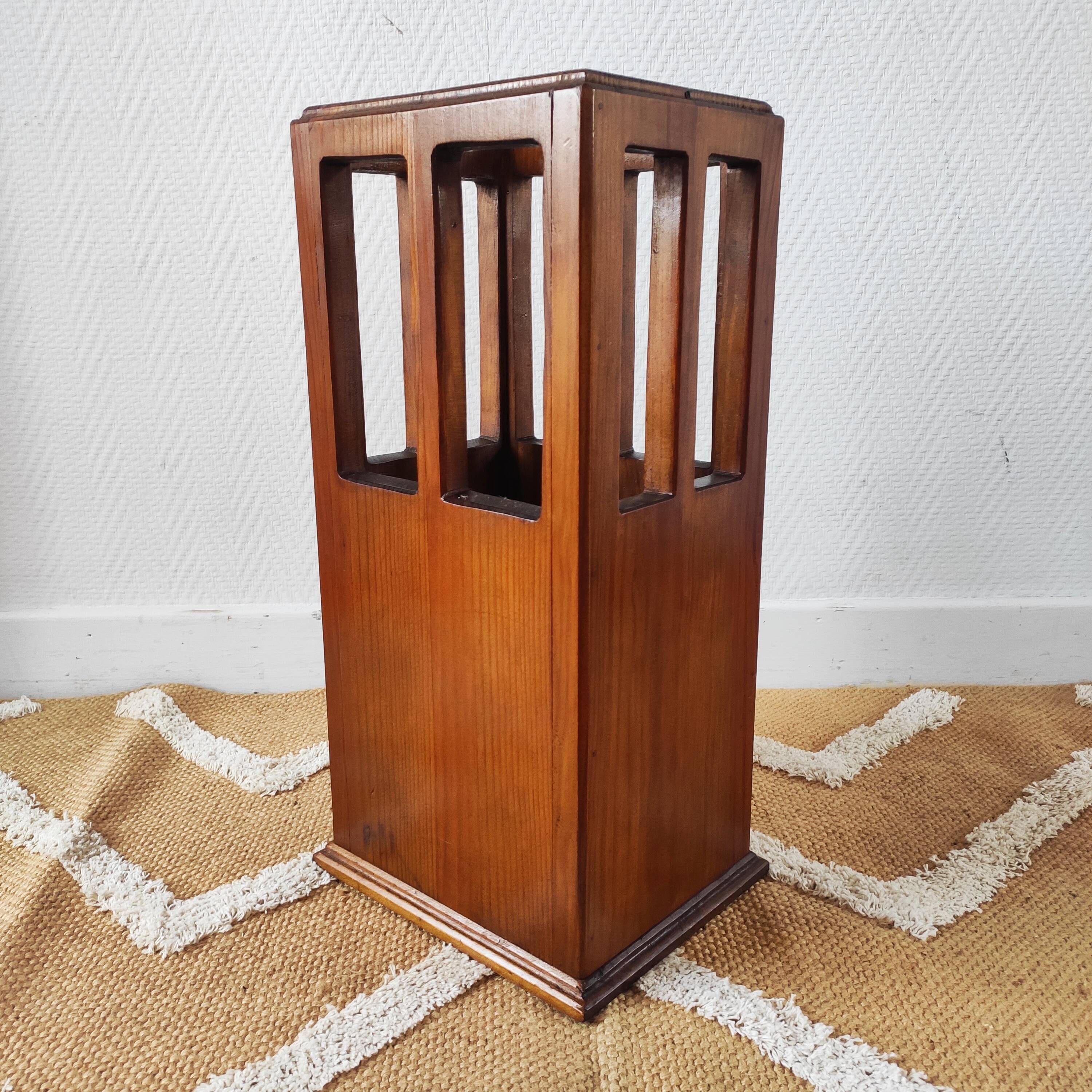 Vintage brutalist umbrella stand made of solid wood.