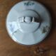 Antique porcelain sugar bowl with a decagonal base.