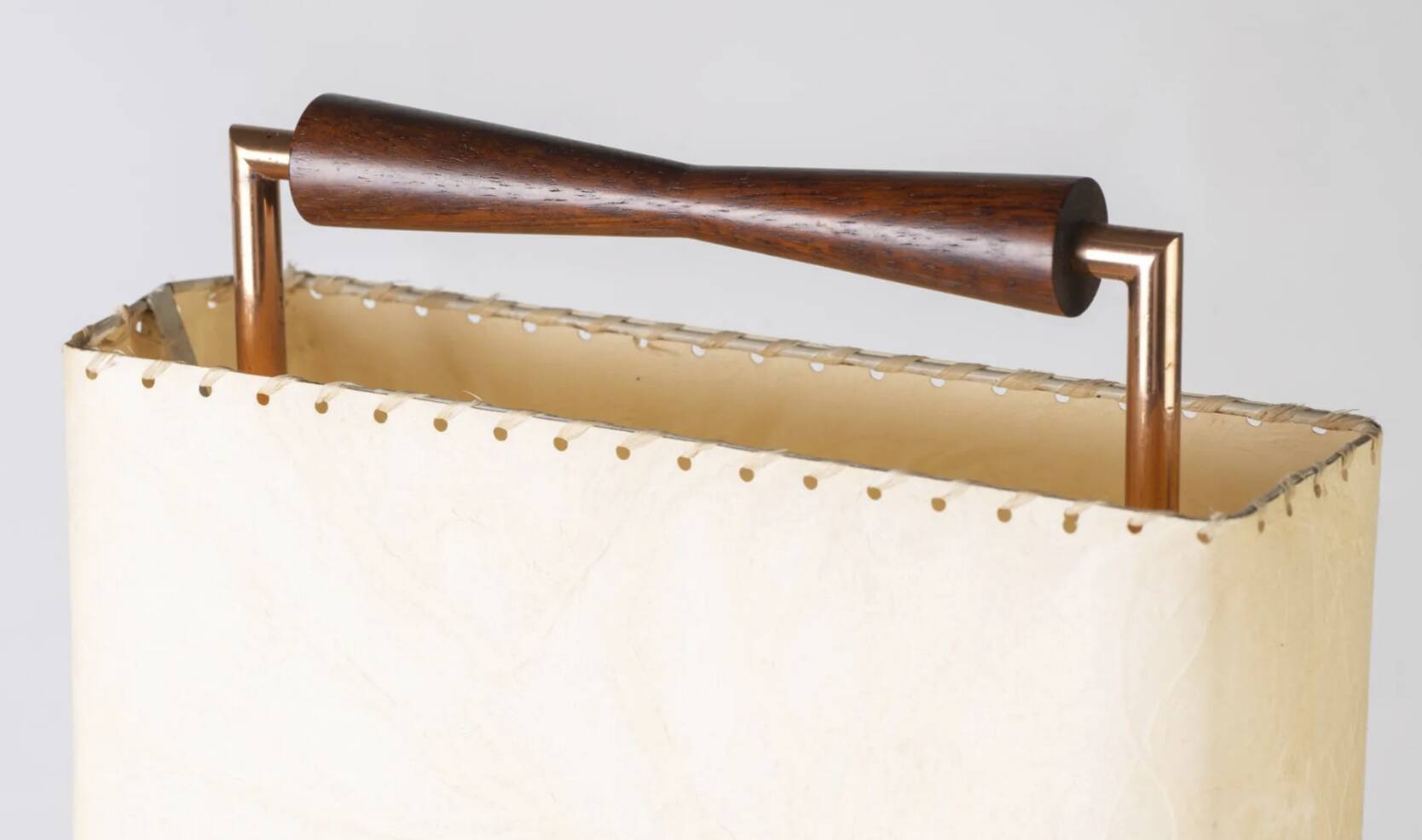Wood and copper metal floor lamp with parchment.