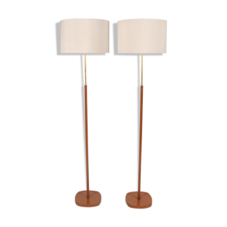 Pair of tan leather floor lamps