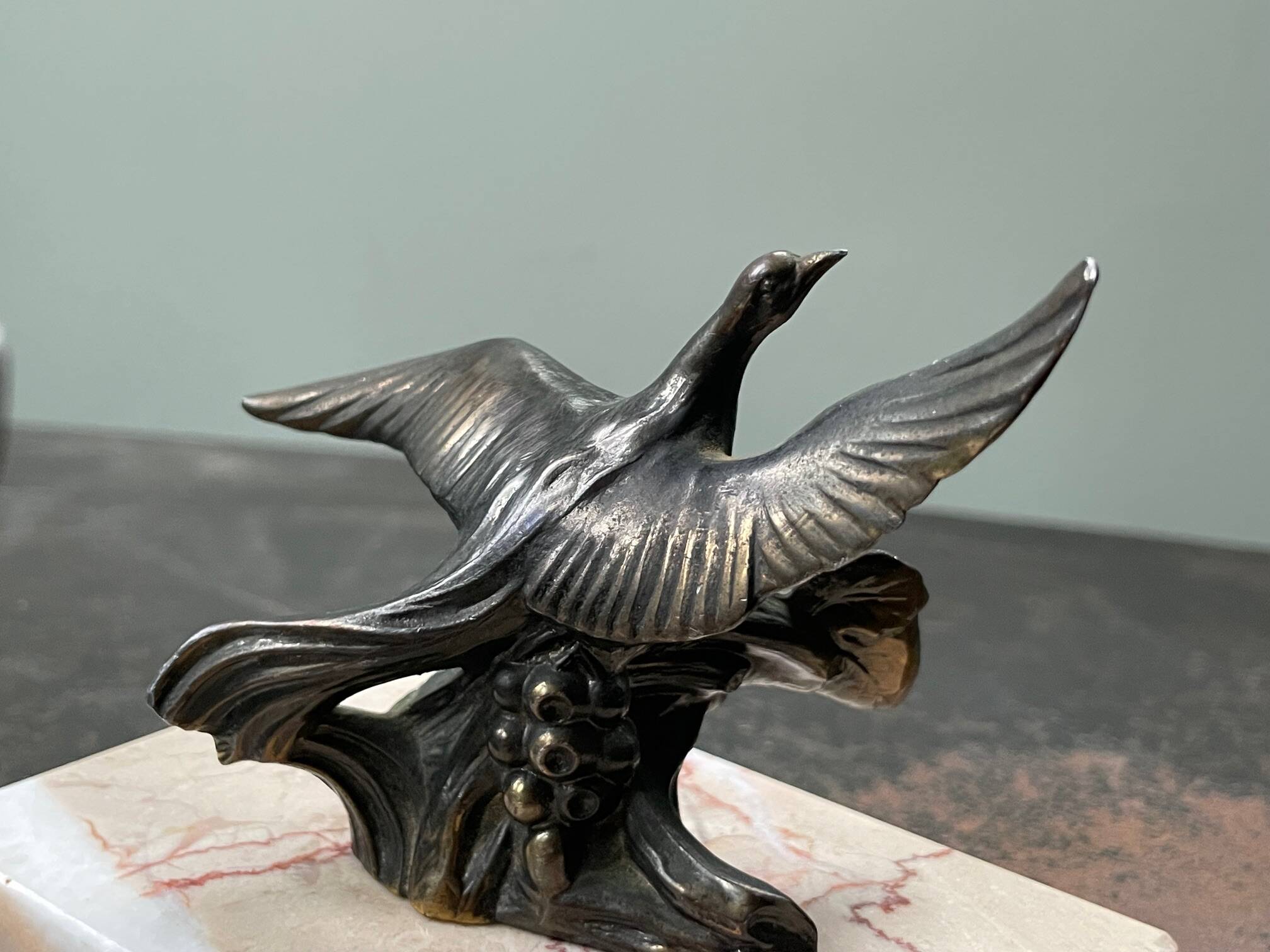 Pair of marble bookends with bronze birds