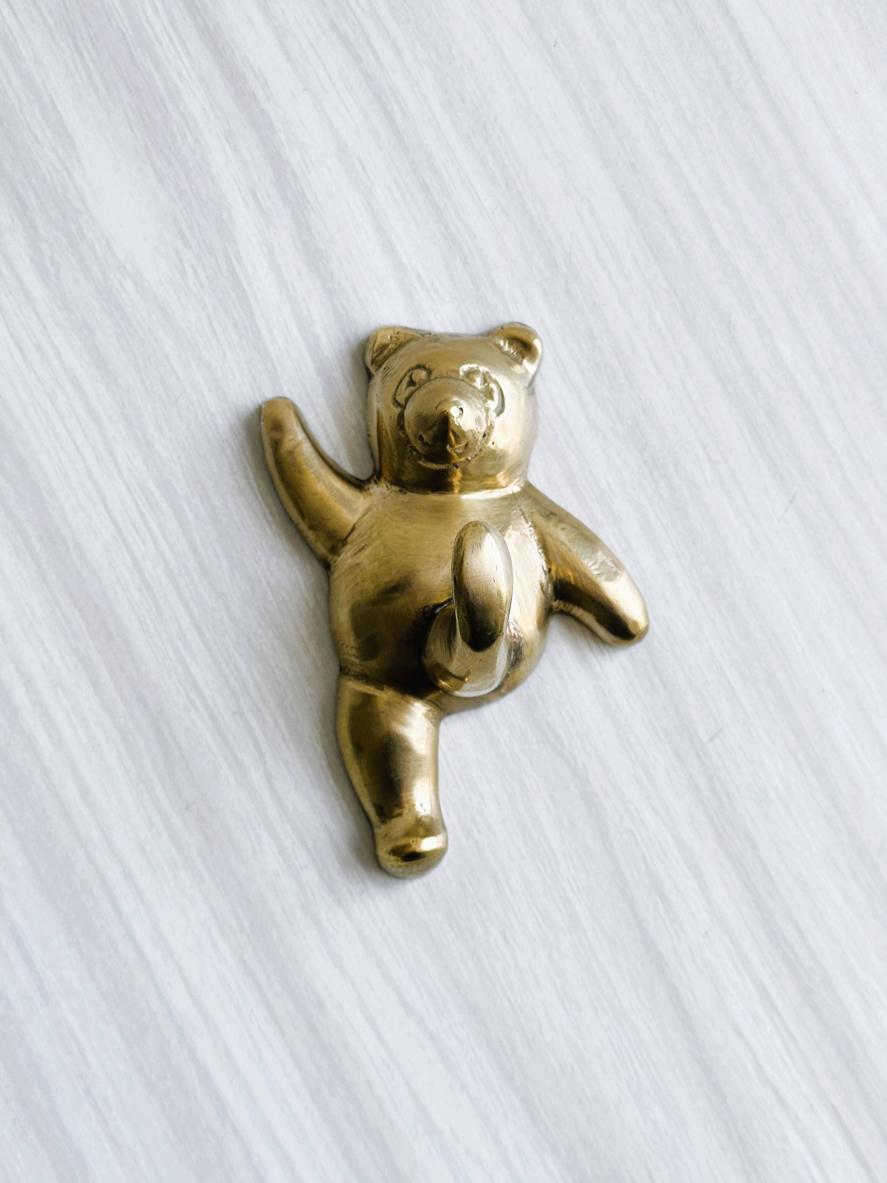 Towel rack - metal bear coat rack.