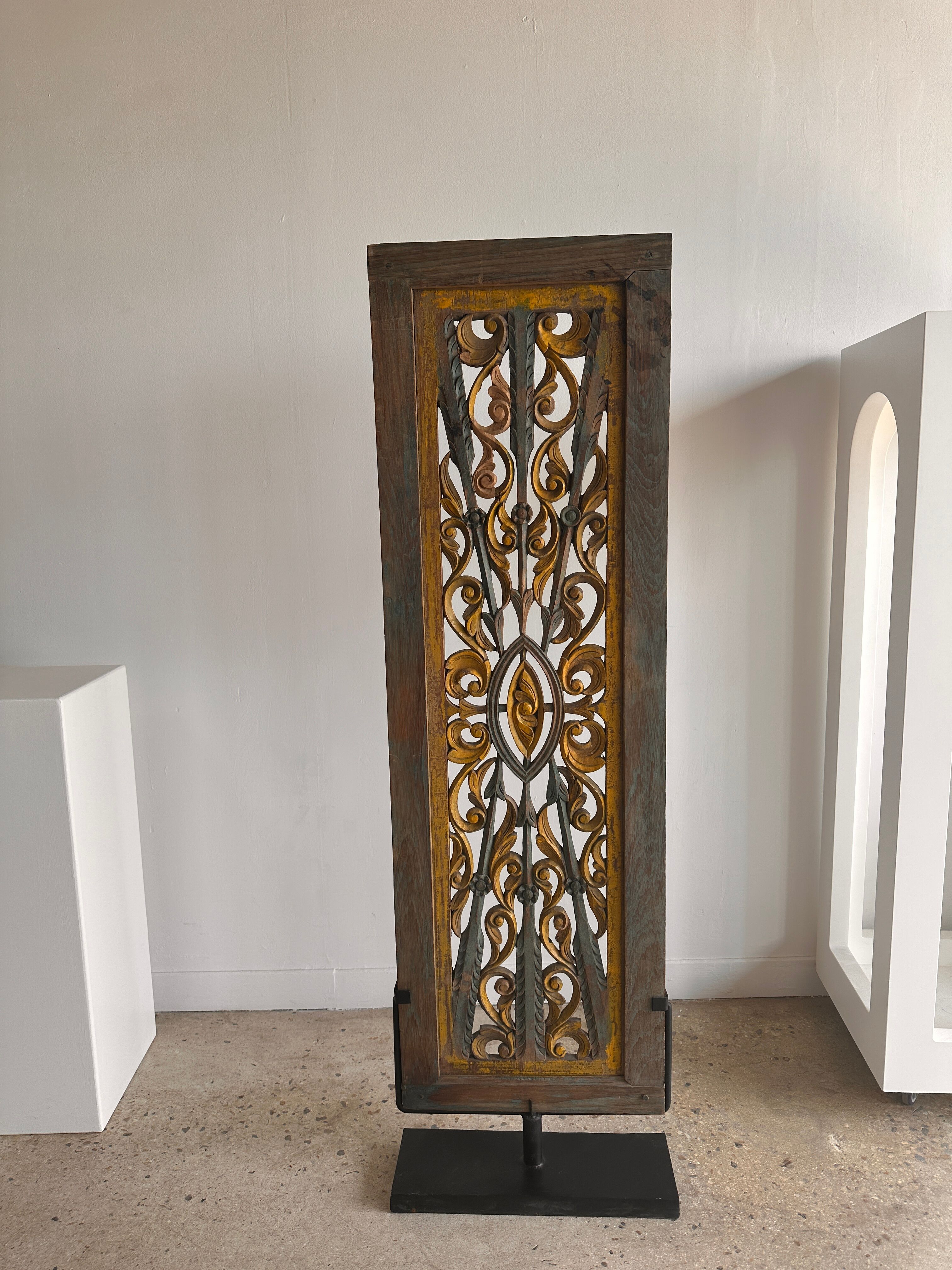 Rectangular Indonesian construction element with blue and yellow plant in carved wood