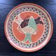 Large handmade dish with fish decoration