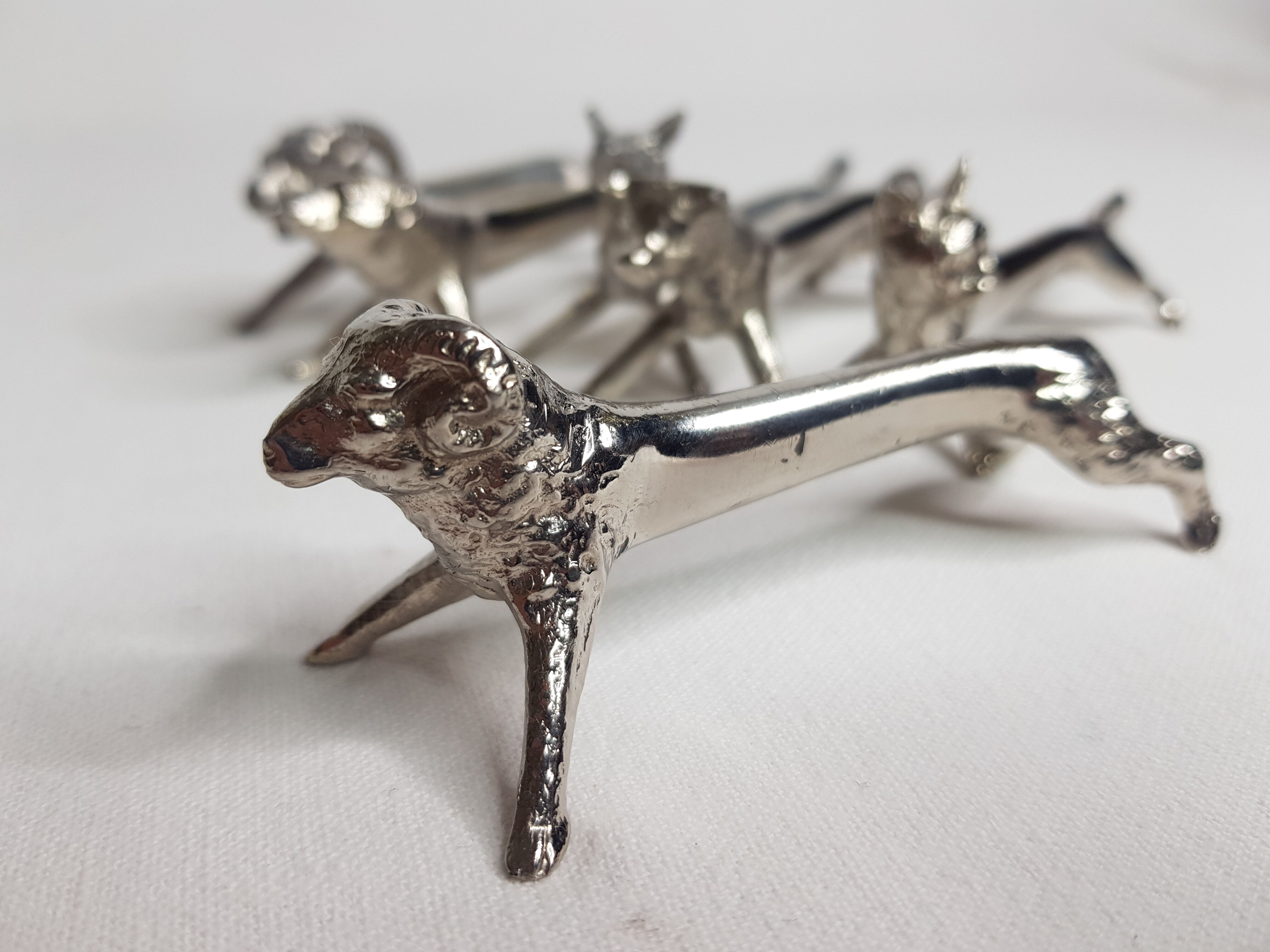 Six old animal knife holders in chrome metal