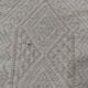 Hand-woven rug in natural wool