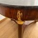 Empire gueridon in mahogany veneer adorned with chiselled and gilded bronze, topped with black marble with a groove.