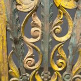 Rectangular Indonesian construction element with blue and yellow plant in carved wood