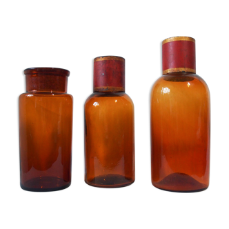 Trio jar and pharmacy in amber glass bottles