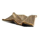 Brutalist bronze pocket emptier