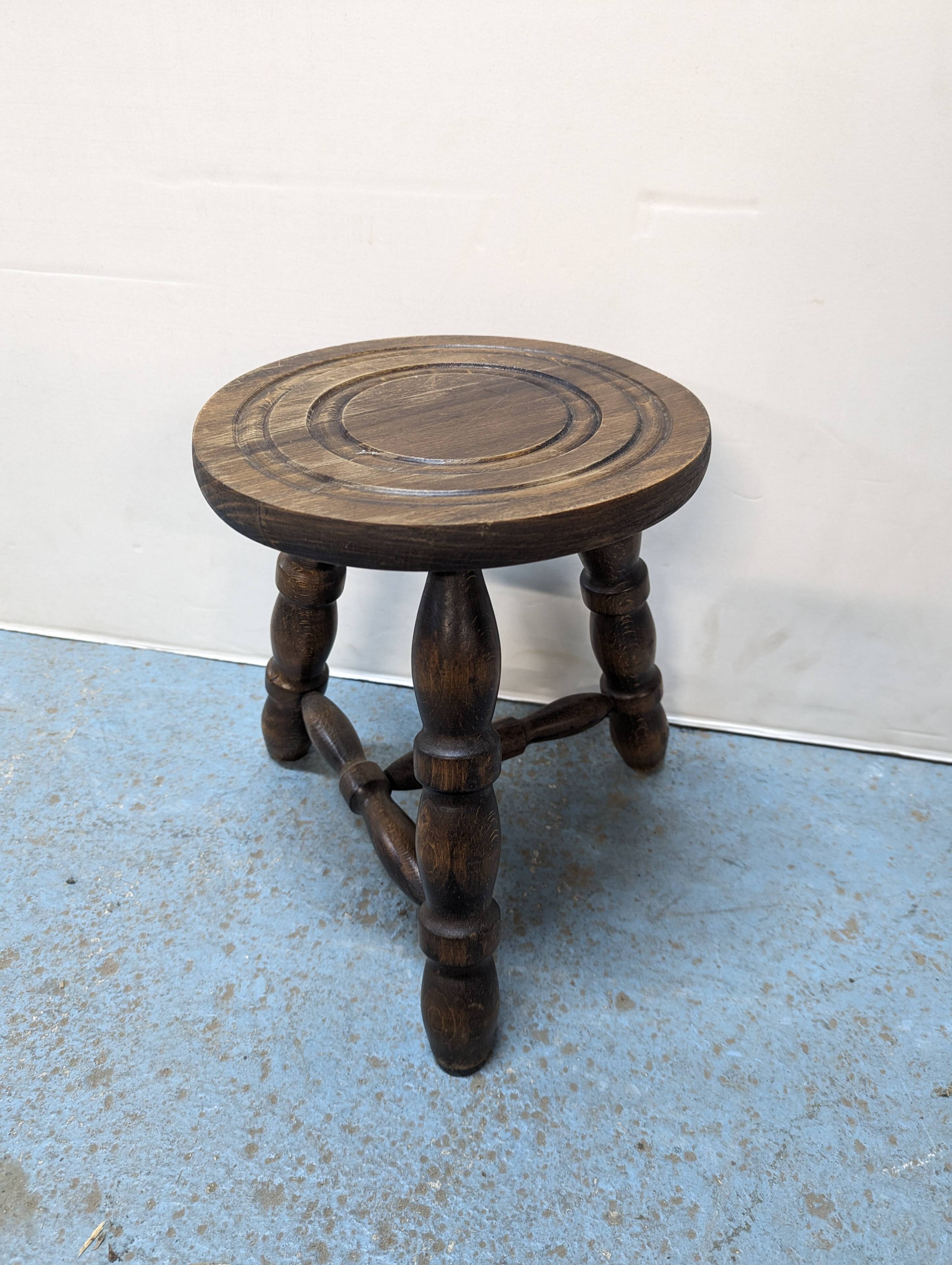 Rustic three-legged oak stool