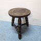 Rustic three-legged oak stool