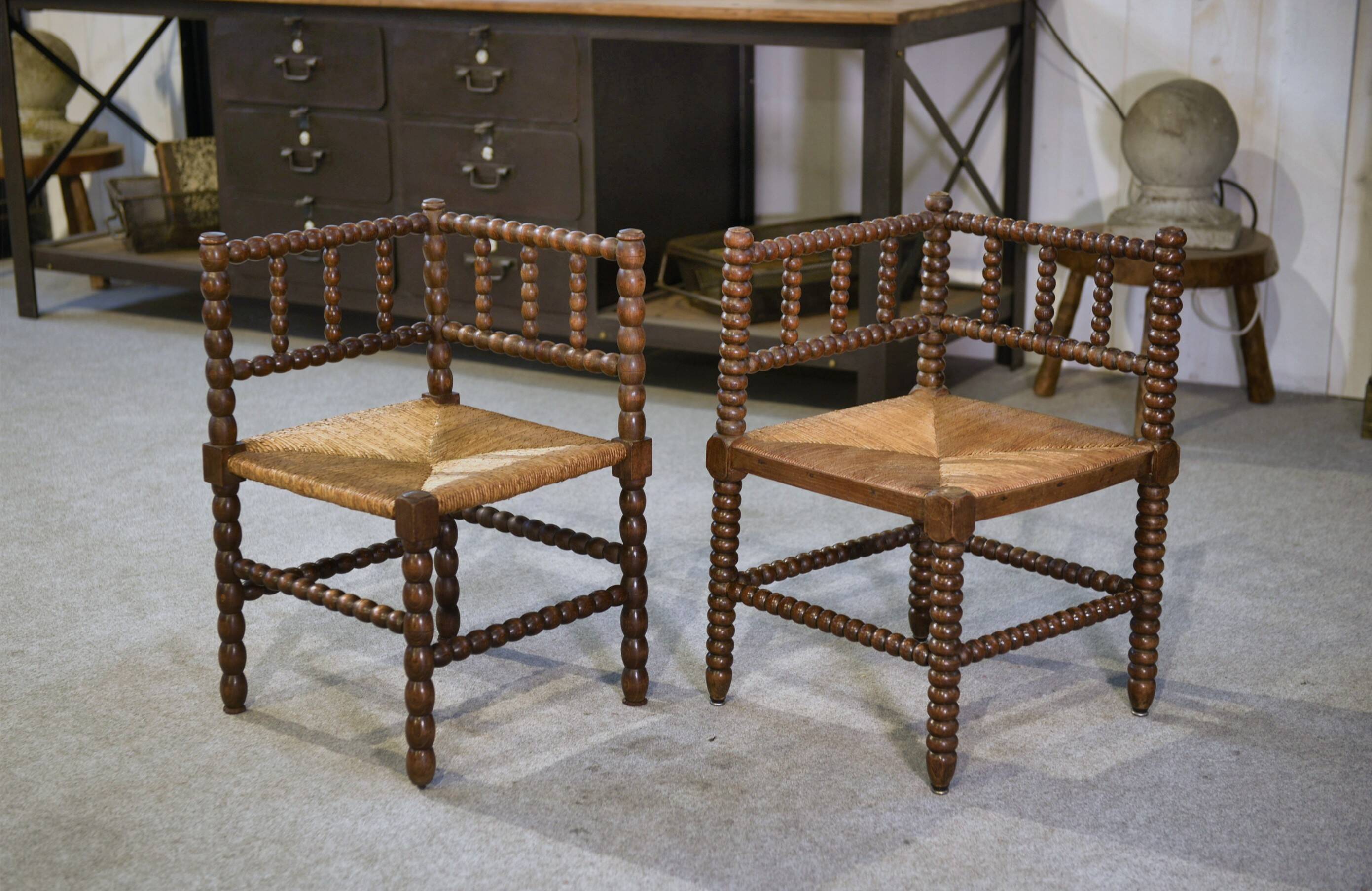 Pair of turned wooden corner chairs from the 1950s.