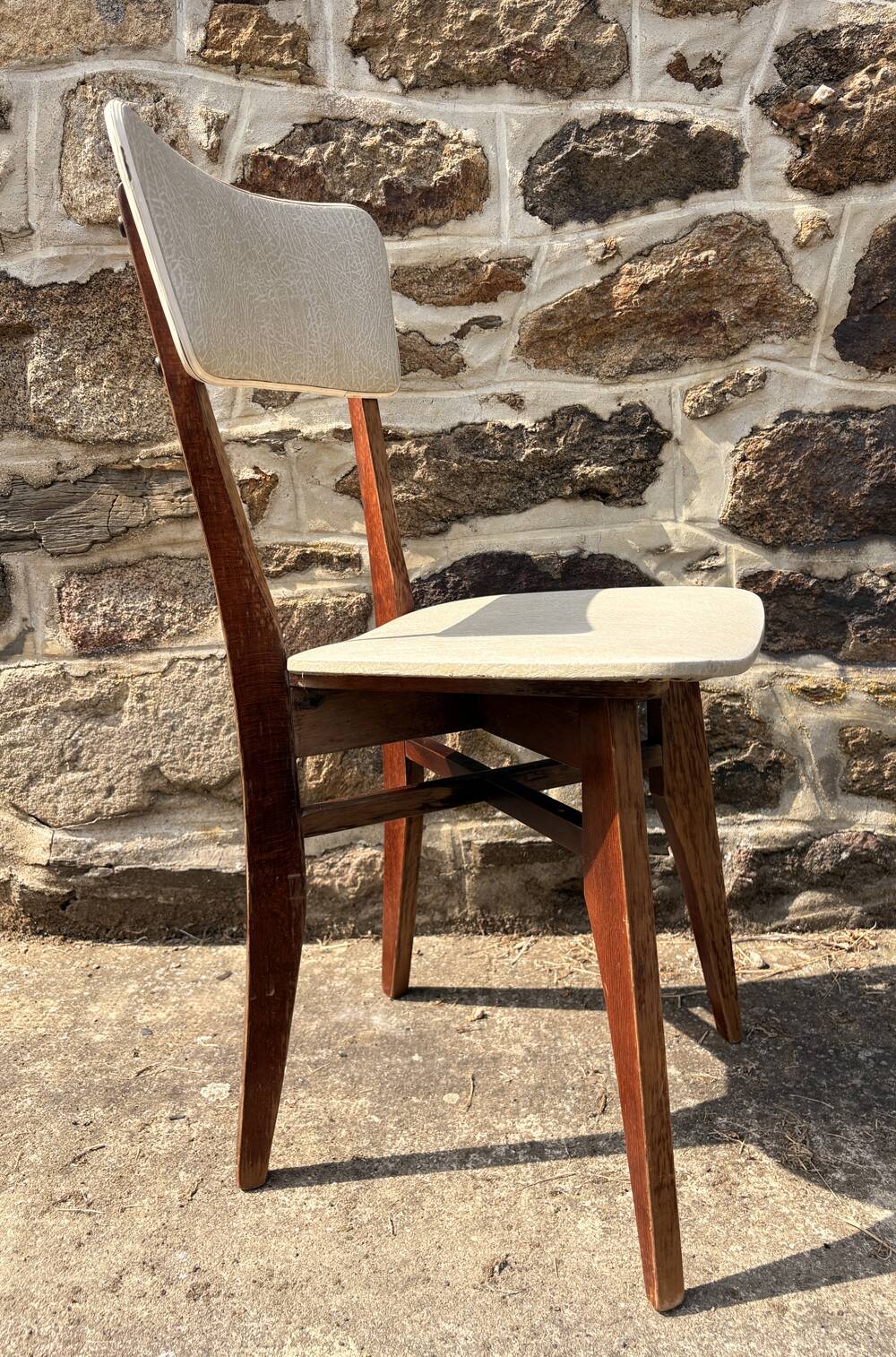Pair of vintage chairs with upholstered backrest and seat, 1950s style.