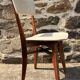Pair of vintage chairs with upholstered backrest and seat, 1950s style.