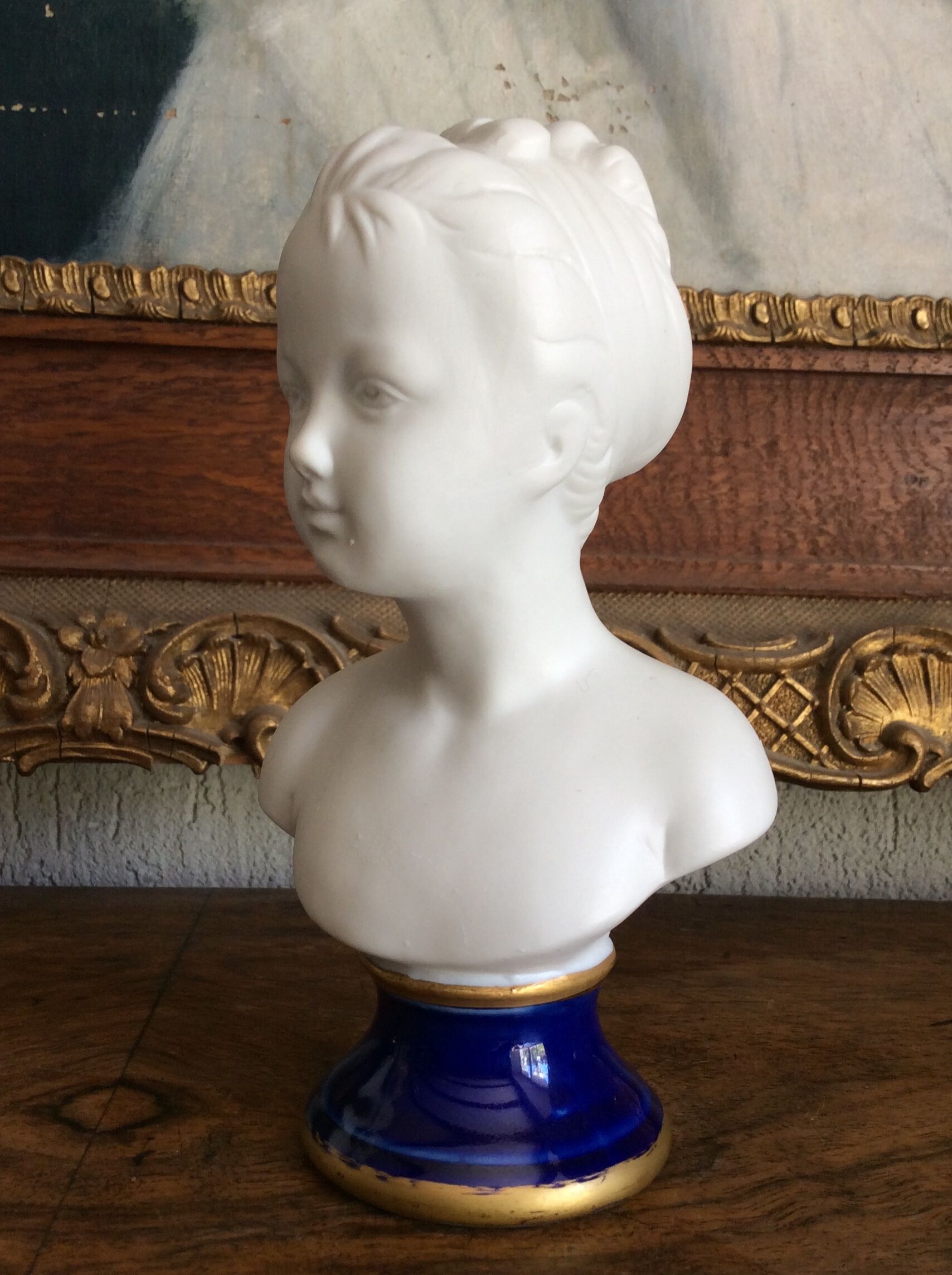 Small biscuit bust with blue base