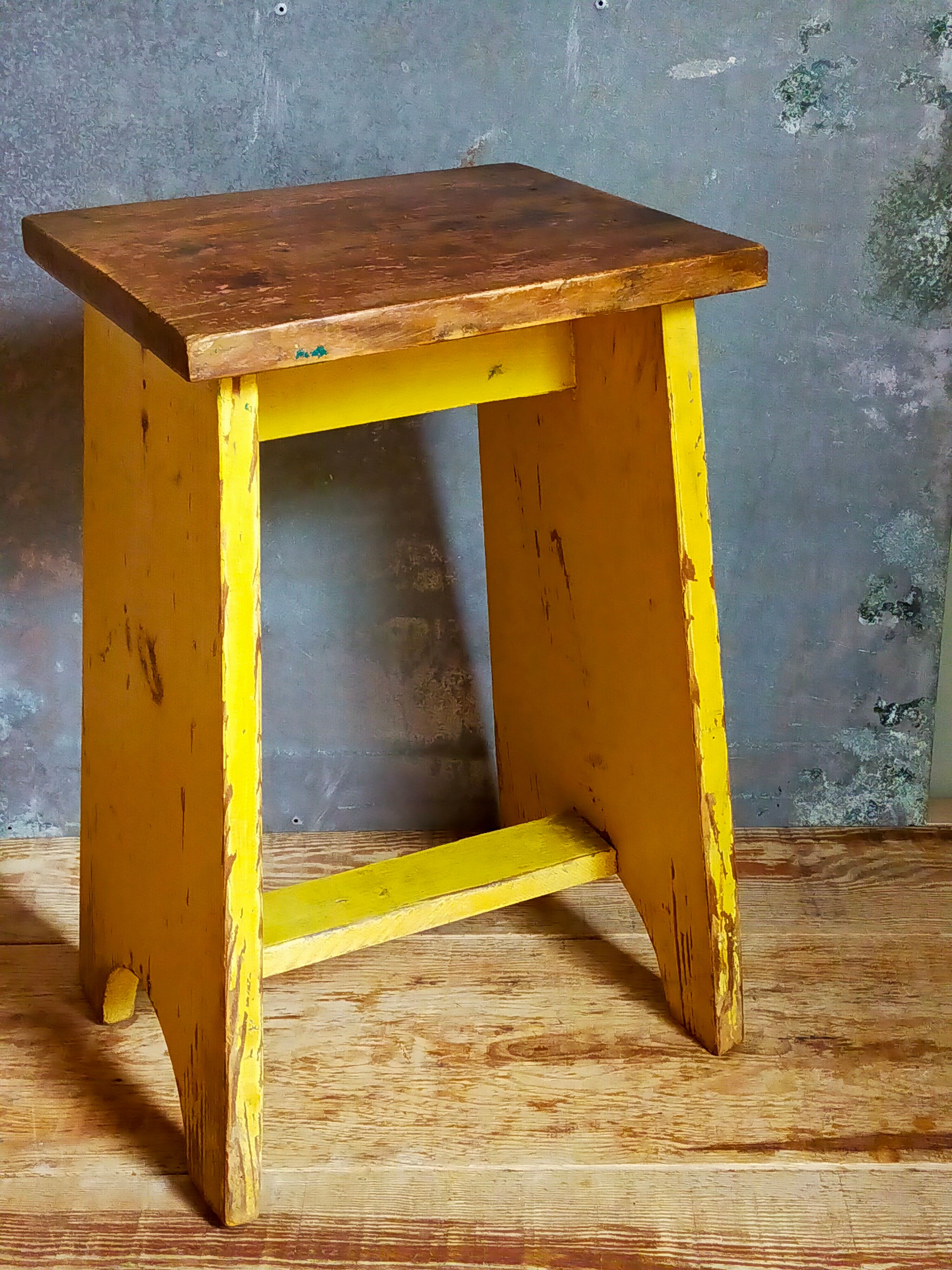 Art-populaire workshop stool in patinated wood