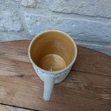 Old terracotta mug with glazed interior