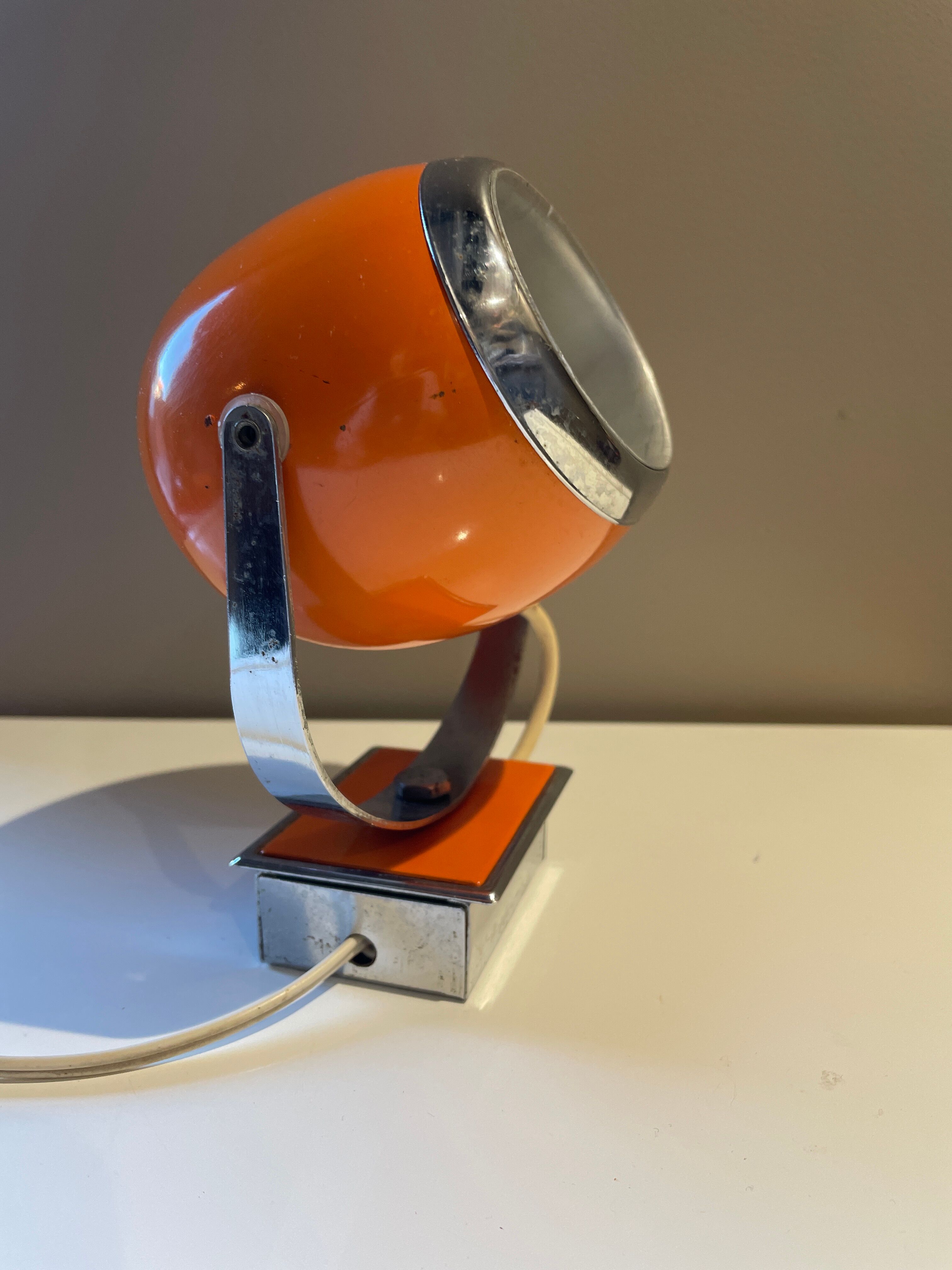 Orange eye ball wall lamp