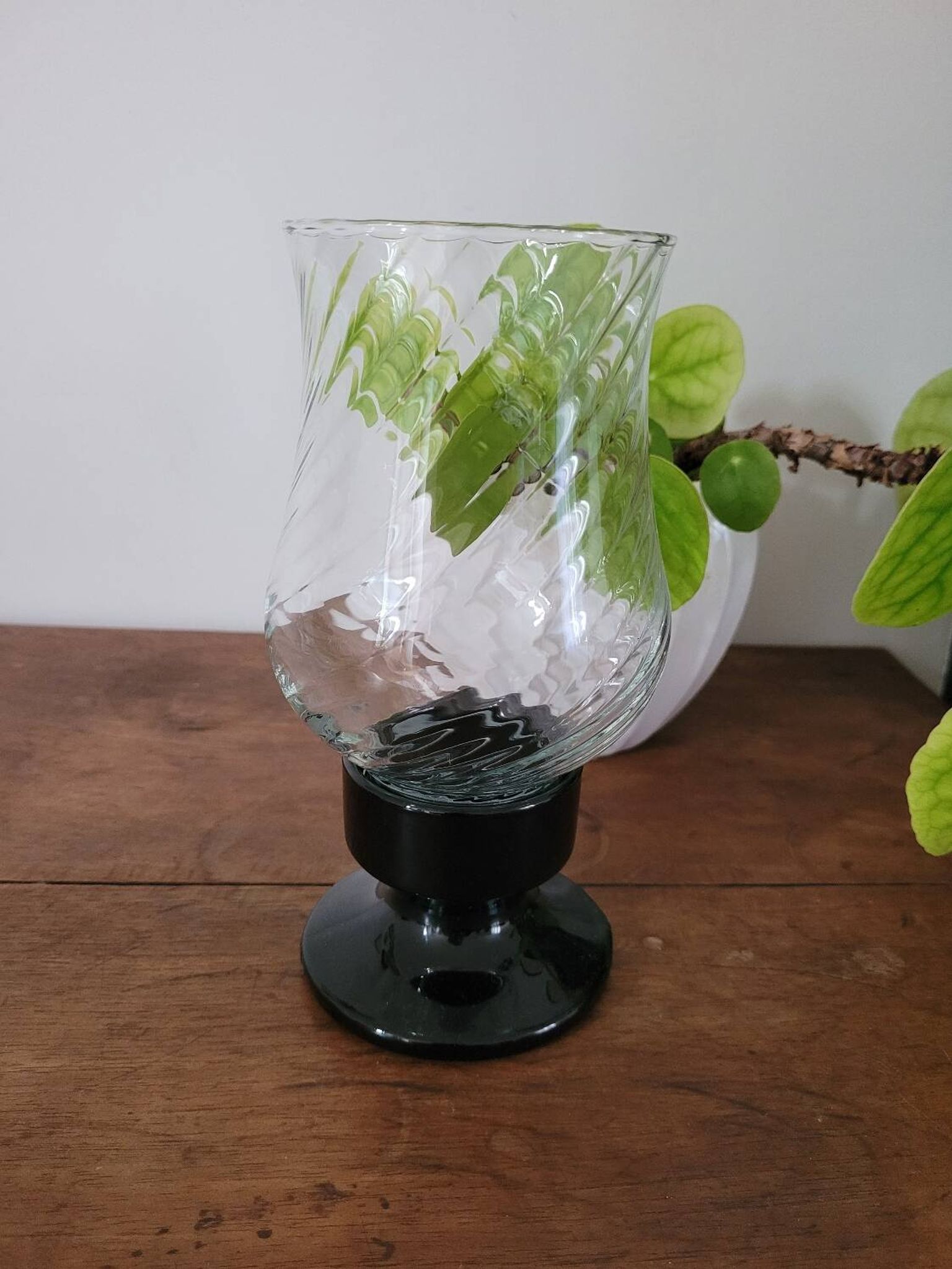 Glass candle holder with black base