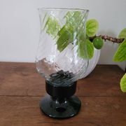 Glass candle holder with black base