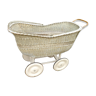 Vintage rattan cradle on wheels