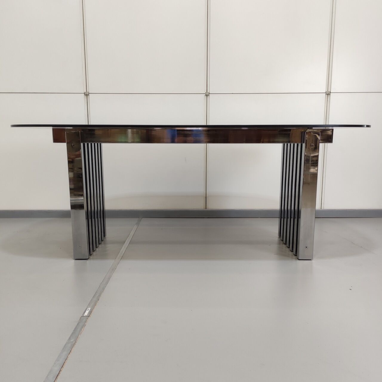 Chrome base diningroom table with smoked glass oval top