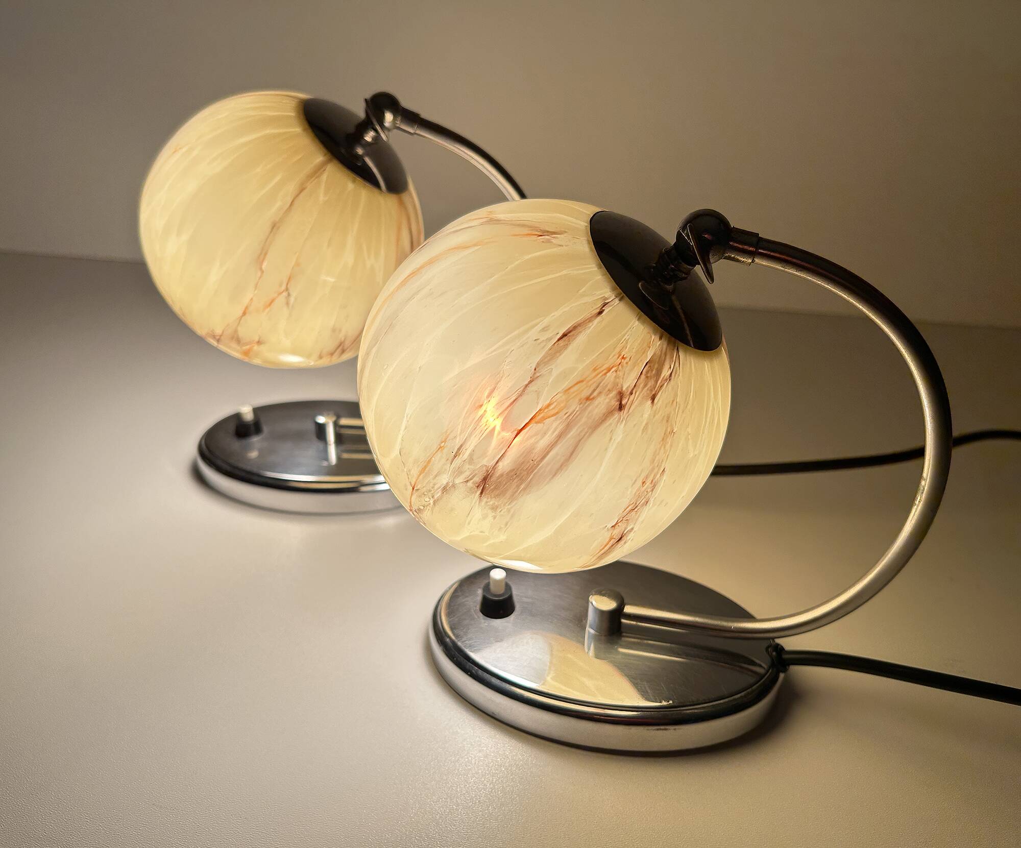 Pair of art deco lamps, chrome glass