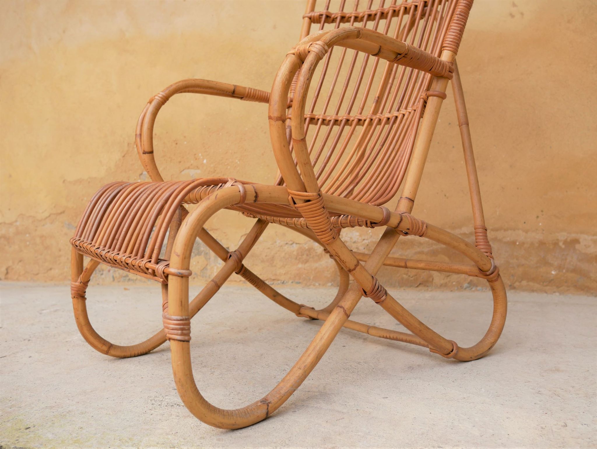 Vintage rattan chair by Louis Sognot
