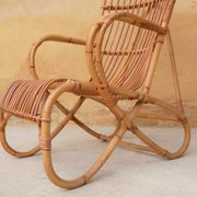 Vintage rattan chair by Louis Sognot