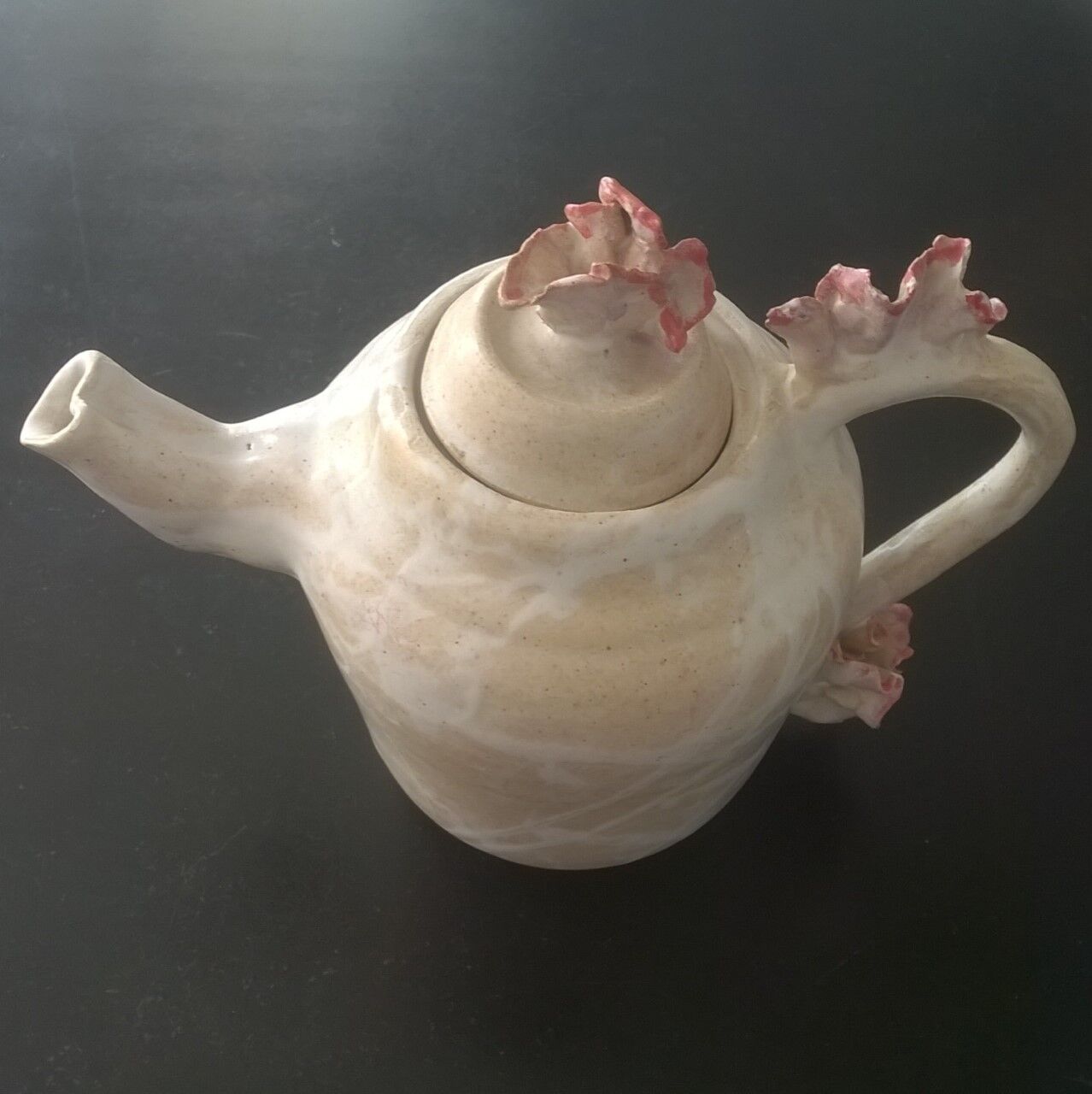 Vintage teapot with relief coral decoration.
